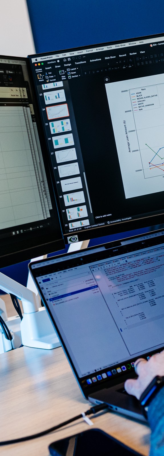 Man sitting at desk in three computer screens while typing