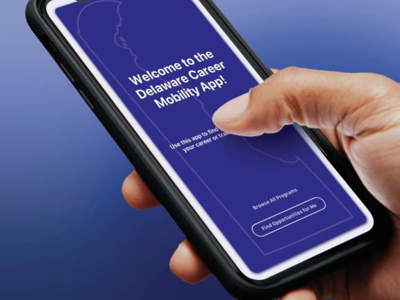 User holding a phone with Delaware Career Mobility App home screen