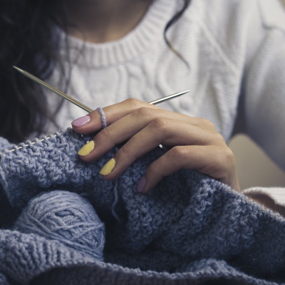 Women knitting blanket
