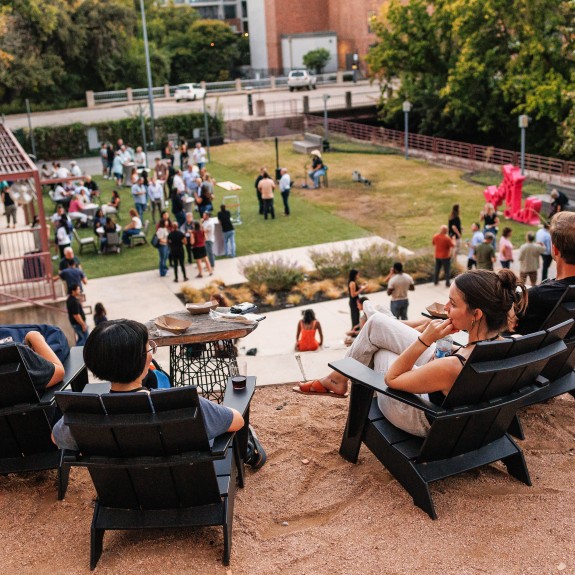 Outdoor reception venue with group of people networking