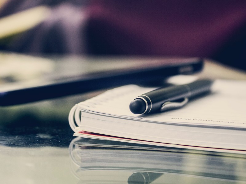 Pen and paper on a desk