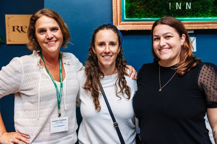 Three women smiling at camera