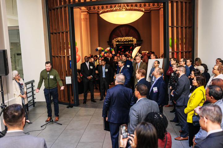 Crowd of people networking at a business event