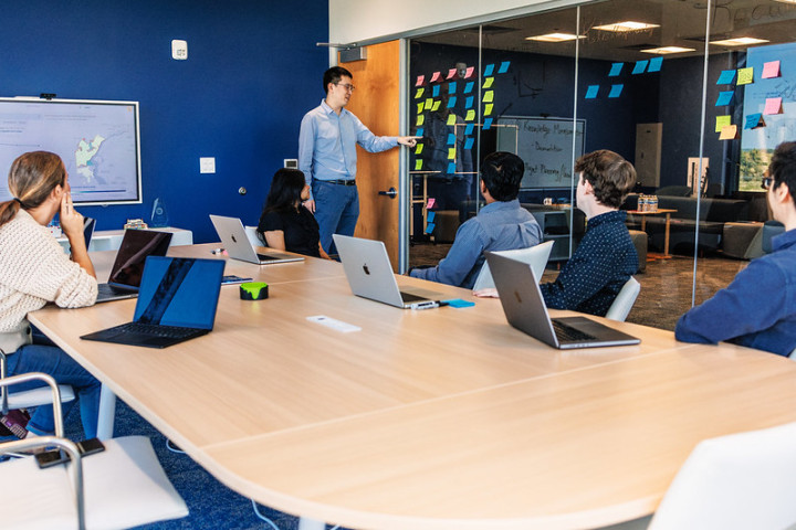 A small group of colleagues at a conference table