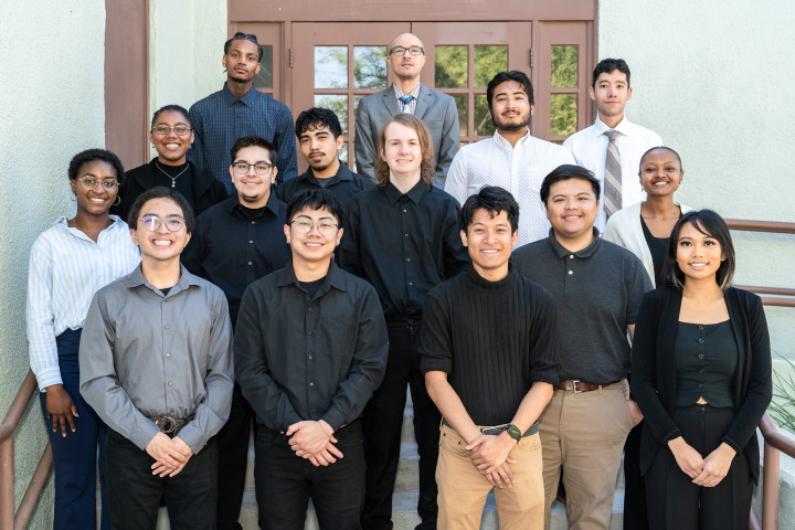 Group of students standing outside posing together